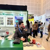 A Bayniyaz Tobacco representative with sample tins at an international tobacco trade show